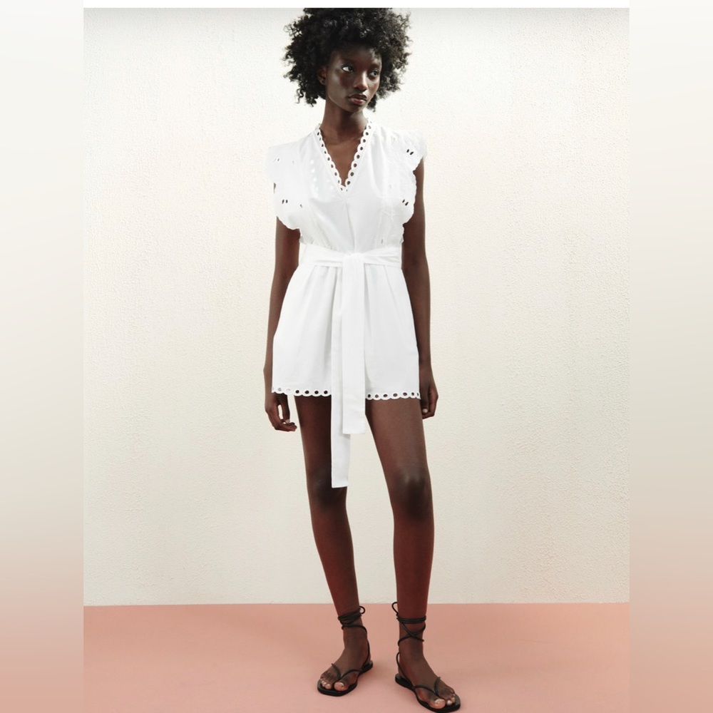 NWT Openwork Embroidery Romper with Bow Belt. Color is white. Size is small.